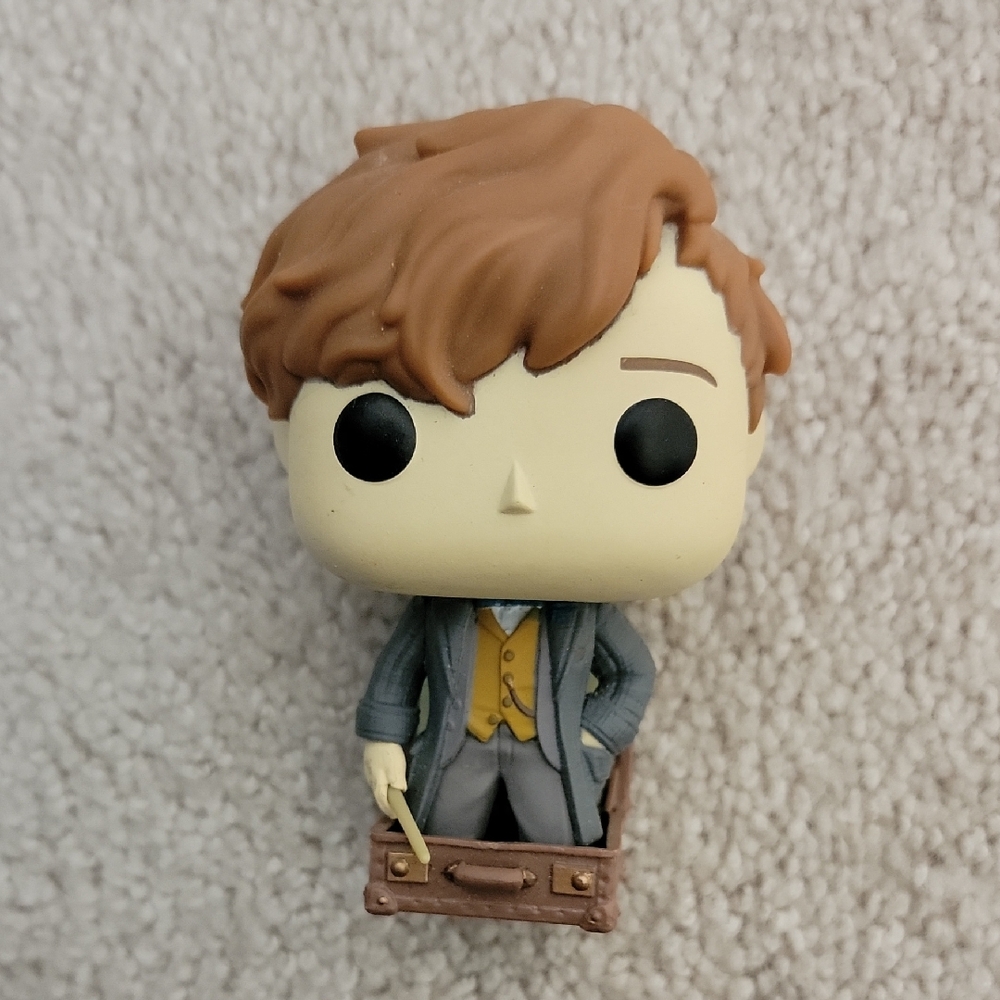 Funko Pop with Brown Hair and Gray Suit